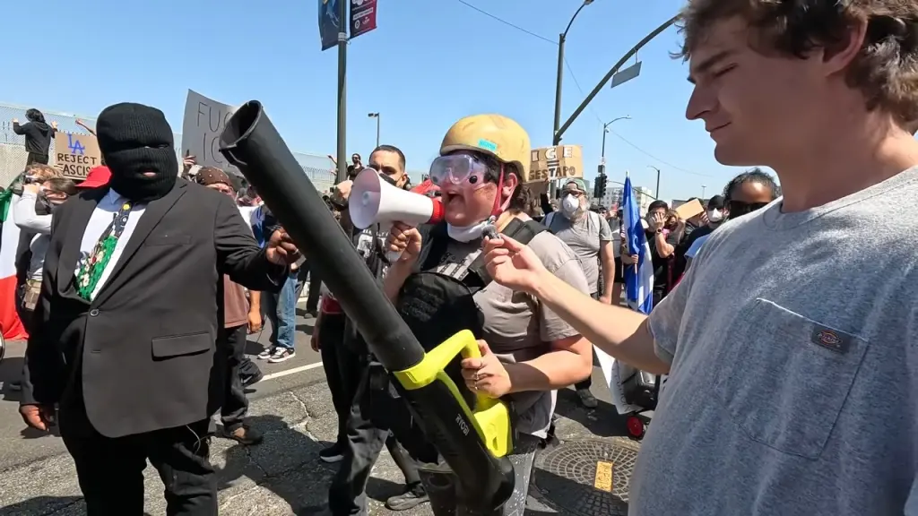 Anti-ICE Protester Hilariously Roasted Over Her Homemade Tactical Suit, Including Leaf Blower [WATCH]