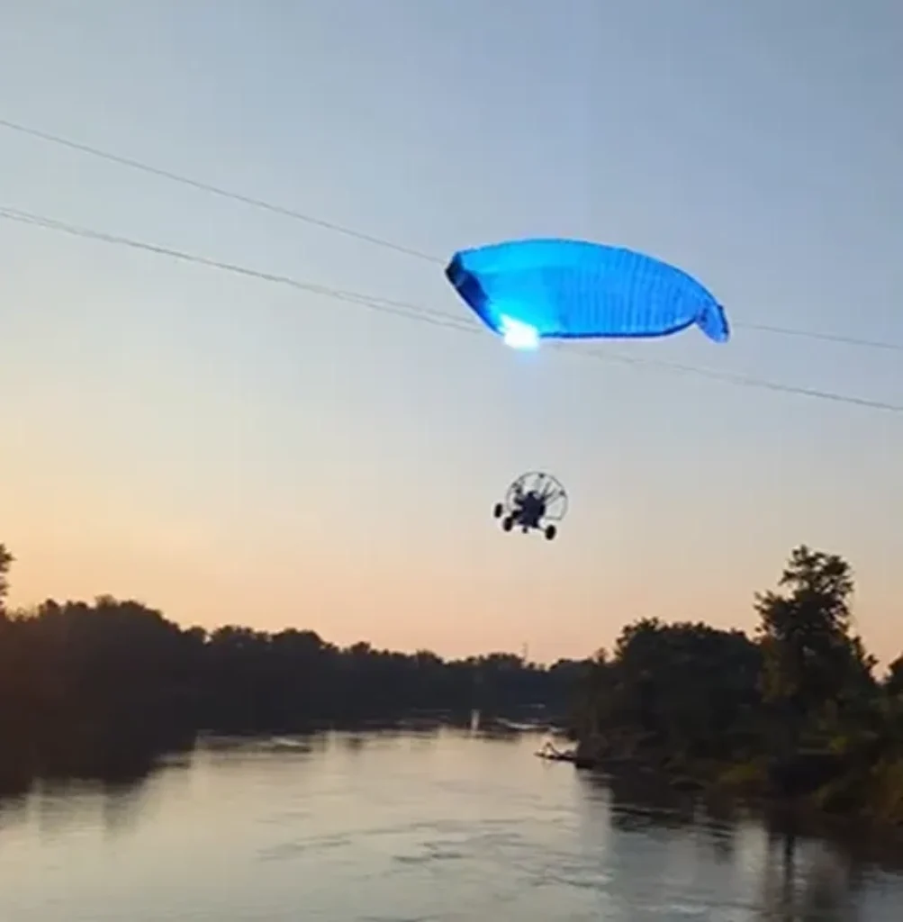 On-Lookers Horrified as North Dakota Paraglider Hits Power Line Plummeting Into River [WATCH]